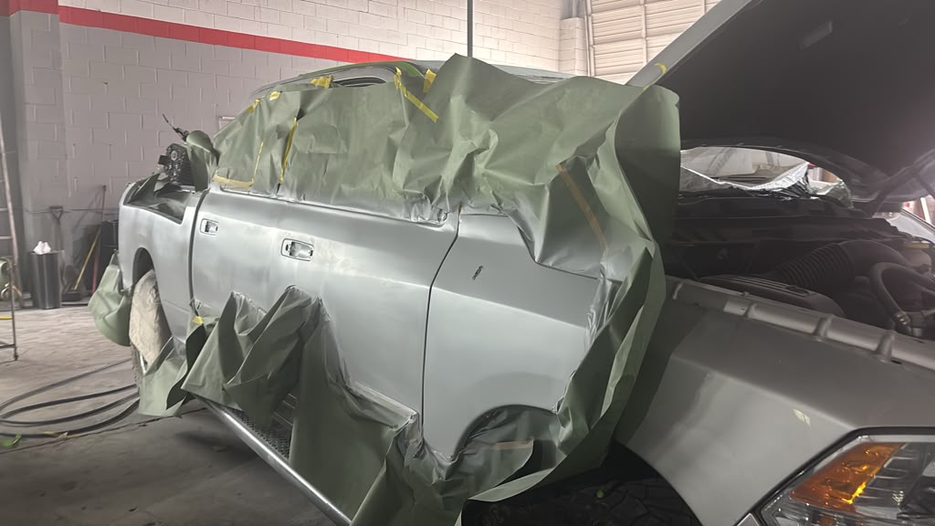 Truck masked off with paper and tape before painting